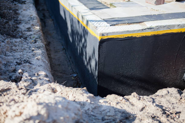 Professional Waterproofing technician working in Upper Falls, MD